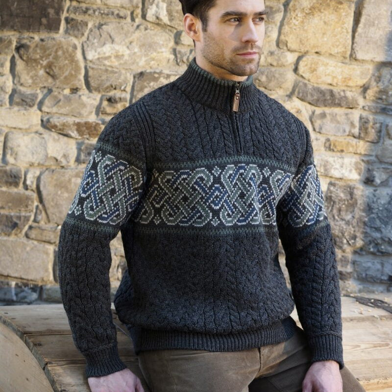 Celtic Jacquard Design Aran Half-Zipped Sweater – 100% Natural Merino Wool 🇮🇪

Color Options: Oatmeal, Charcoal, Dark Green
Material: 100% Natural Merino Wool
Sizes: Small to XXLarge
Made in Ireland 🍀

Product Description:
Embrace warmth and tradition with our Celtic Jacquard Aran Half-Zip Sweater. Crafted from 100% Merino wool, it combines comfort, durability, and a stunning Celtic design woven in tundra green and mallard blue.

Key Features:

Soft Merino Wool: Warm, soft, and durable 🌟
Celtic Jacquard