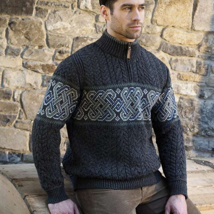 Celtic Jacquard Design Aran Half-Zipped Sweater – 100% Natural Merino Wool 🇮🇪

Color Options: Oatmeal, Charcoal, Dark Green
Material: 100% Natural Merino Wool
Sizes: Small to XXLarge
Made in Ireland 🍀

Product Description:
Embrace warmth and tradition with our Celtic Jacquard Aran Half-Zip Sweater. Crafted from 100% Merino wool, it combines comfort, durability, and a stunning Celtic design woven in tundra green and mallard blue.