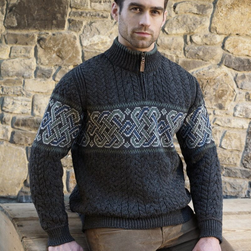 Celtic Jacquard Design Aran Half-Zipped Sweater – 100% Natural Merino Wool 🇮🇪

Color Options: Oatmeal, Charcoal, Dark Green
Material: 100% Natural Merino Wool
Sizes: Small to XXLarge
Made in Ireland 🍀

Product Description:
Embrace warmth and tradition with our Celtic Jacquard Aran Half-Zip Sweater. Crafted from 100% Merino wool, it combines comfort, durability, and a stunning Celtic design woven in tundra green and mallard blue.

Key Features:

Soft Merino Wool: Warm, soft, and durable 🌟
Celtic Jacquard