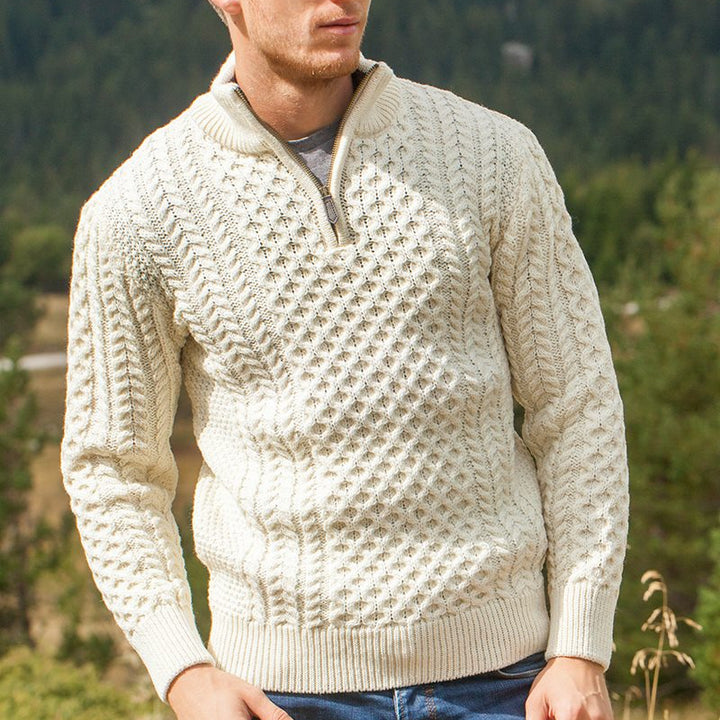 Elevate your wardrobe with our Men’s Irish Full-Zip Aran Sweater, crafted for the modern gentleman who values warmth, comfort, and heritage. This versatile sweater seamlessly blends traditional Irish craftsmanship with contemporary functionality.

🌟 Key Features
🐑 Premium Material: Made from 100% Merino wool, delivering exceptional softness, warmth, and breathability—perfect for cool weather or layering.
🌀 Classic Aran Stitching: Showcasing traditional Aran patterns on both the front and back, celebratin