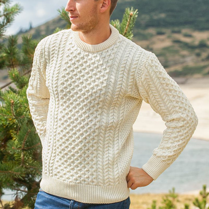 Irish Aran Knit Sweater – Timeless Craftsmanship and Comfort

Discover the perfect blend of tradition and style with our unisex Irish Aran Knit Sweater, crafted in Ireland using 100% super-soft Merino wool. 🌿

Luxurious Comfort: Soft, durable, and naturally breathable for year-round wear.
Rich Heritage: Features iconic Aran stitches like cable, honeycomb, and diamond, symbolizing strength, luck, and connection.
Crafted in Ireland: Made with care by skilled artisans, celebrating Irish knitting traditions.
