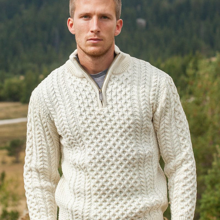 Elevate your wardrobe with our Men’s Irish Full-Zip Aran Sweater, crafted for the modern gentleman who values warmth, comfort, and heritage. This versatile sweater seamlessly blends traditional Irish craftsmanship with contemporary functionality.

🌟 Key Features
🐑 Premium Material: Made from 100% Merino wool, delivering exceptional softness, warmth, and breathability—perfect for cool weather or layering.
🌀 Classic Aran Stitching: Showcasing traditional Aran patterns on both the front and back, celebratin