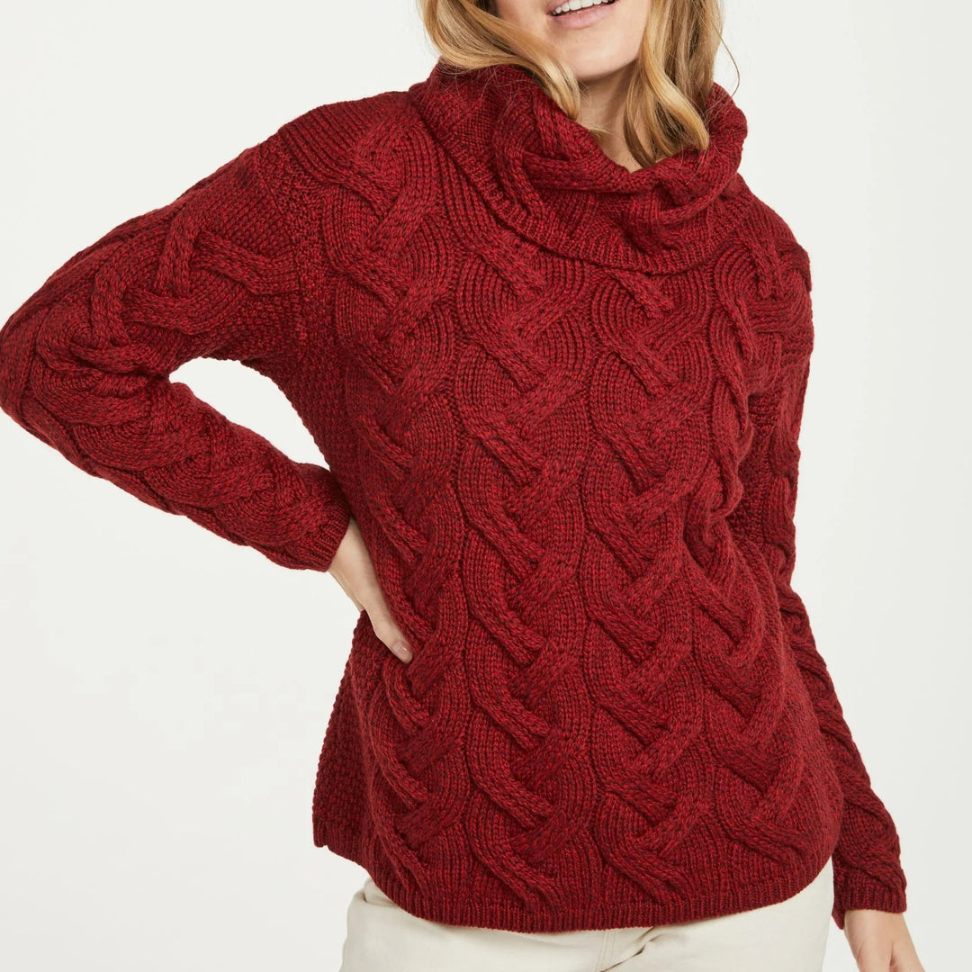 Kinsale 100% Aran Knit Sweater – Timeless Irish Style ☘️

Experience year-round warmth and elegance with the Kinsale Aran Knit Sweater, crafted from super-soft Merino wool by Aran Crafts.

✨ Features:

Iconic Cable Stitch: Bold Aran cable stitching takes center stage, complemented by subtle moss stitch side panels.
Elegant Cowl Neck: Adds a cozy and stylish touch.
Heritage Design: Inspired by the rich history of Aran knitwear, made famous globally in the 1950s.