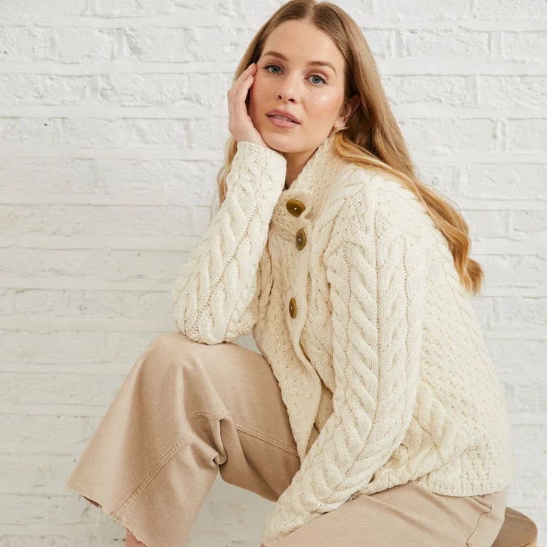 ☘️ Ladies Irish-Made Cable Knit Aran Cardigan 🧶
Comfort, Versatility, and Timeless Elegance

Wrap yourself in the warmth of tradition with our Ladies Irish-Made Cable Knit Aran Cardigan, a perfect fusion of heritage and modern style.

🌟 Key Features You’ll Love:
🧵 Premium Material: Crafted from 100% Supersoft Merino Wool, ensuring exceptional softness and warmth.
✨ Elegant Design: Features a stunning overlapping central trellis panel, combining classic Aran texture with a contemporary twist.
