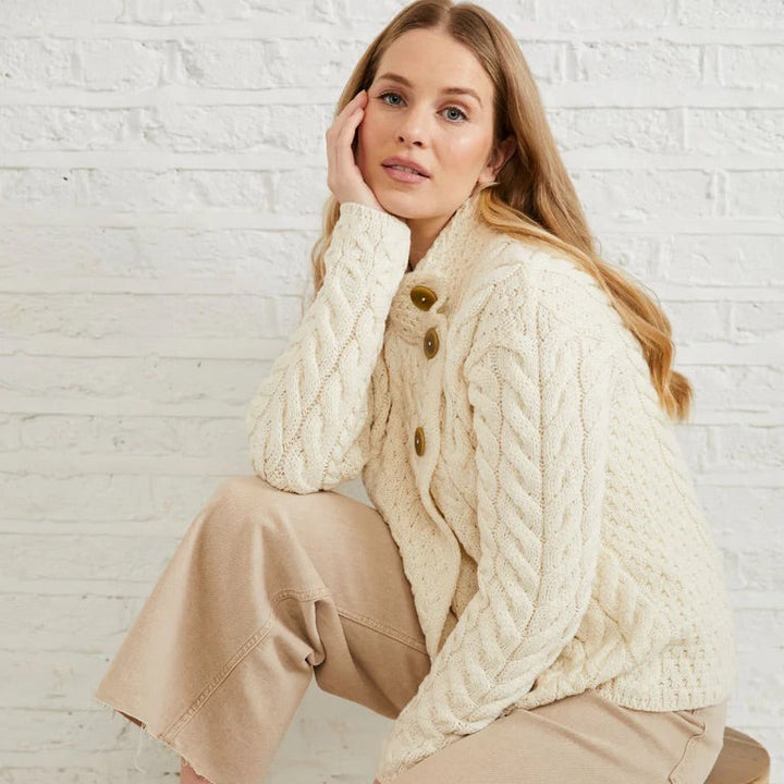 ☘️ Ladies Irish-Made Cable Knit Aran Cardigan 🧶
Comfort, Versatility, and Timeless Elegance

Wrap yourself in the warmth of tradition with our Ladies Irish-Made Cable Knit Aran Cardigan, a perfect fusion of heritage and modern style.

🌟 Key Features You’ll Love:
🧵 Premium Material: Crafted from 100% Supersoft Merino Wool, ensuring exceptional softness and warmth.
✨ Elegant Design: Features a stunning overlapping central trellis panel, combining classic Aran texture with a contemporary twist.
