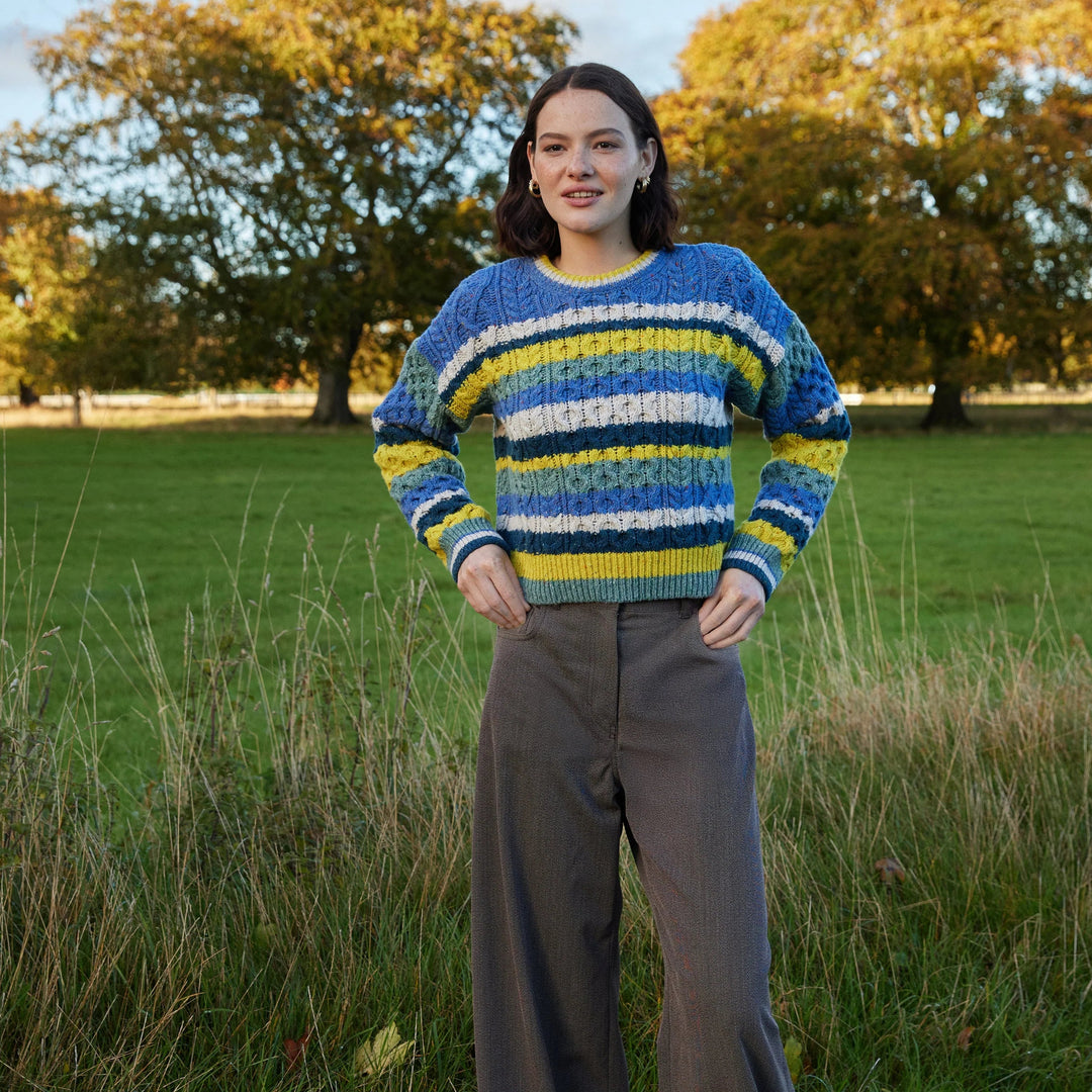 Maya Multi-Coloured Aran Sweater – Genesis Collection 🧶🌈

Part of the Genesis Collection, the ‘Maya’ sweater is a fresh take on classic Aran knitwear. It combines traditional Aran stitches with a playful, contemporary silhouette and bold multi-coloured stripes for a standout look.

✨ Designed with a vibrant marina base and contrasting stripes of chalkstone, ink marl, ocean mist &amp;amp; buttercup, this cropped yet generous sweater is all about modern comfort with timeless style.