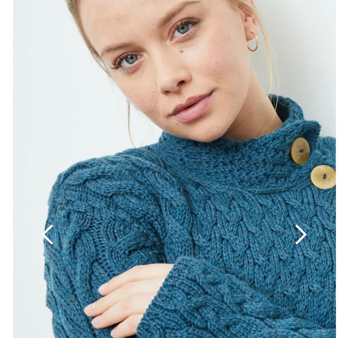 ☘️ Ladies Irish-Made Cable Knit Aran Cardigan 🧶
Comfort, Versatility, and Timeless Elegance

Wrap yourself in the warmth of tradition with our Ladies Irish-Made Cable Knit Aran Cardigan, a perfect fusion of heritage and modern style.

🌟 Key Features You’ll Love:
🧵 Premium Material: Crafted from 100% Supersoft Merino Wool, ensuring exceptional softness and warmth.
✨ Elegant Design: Features a stunning overlapping central trellis panel, combining classic Aran texture with a contemporary twist.