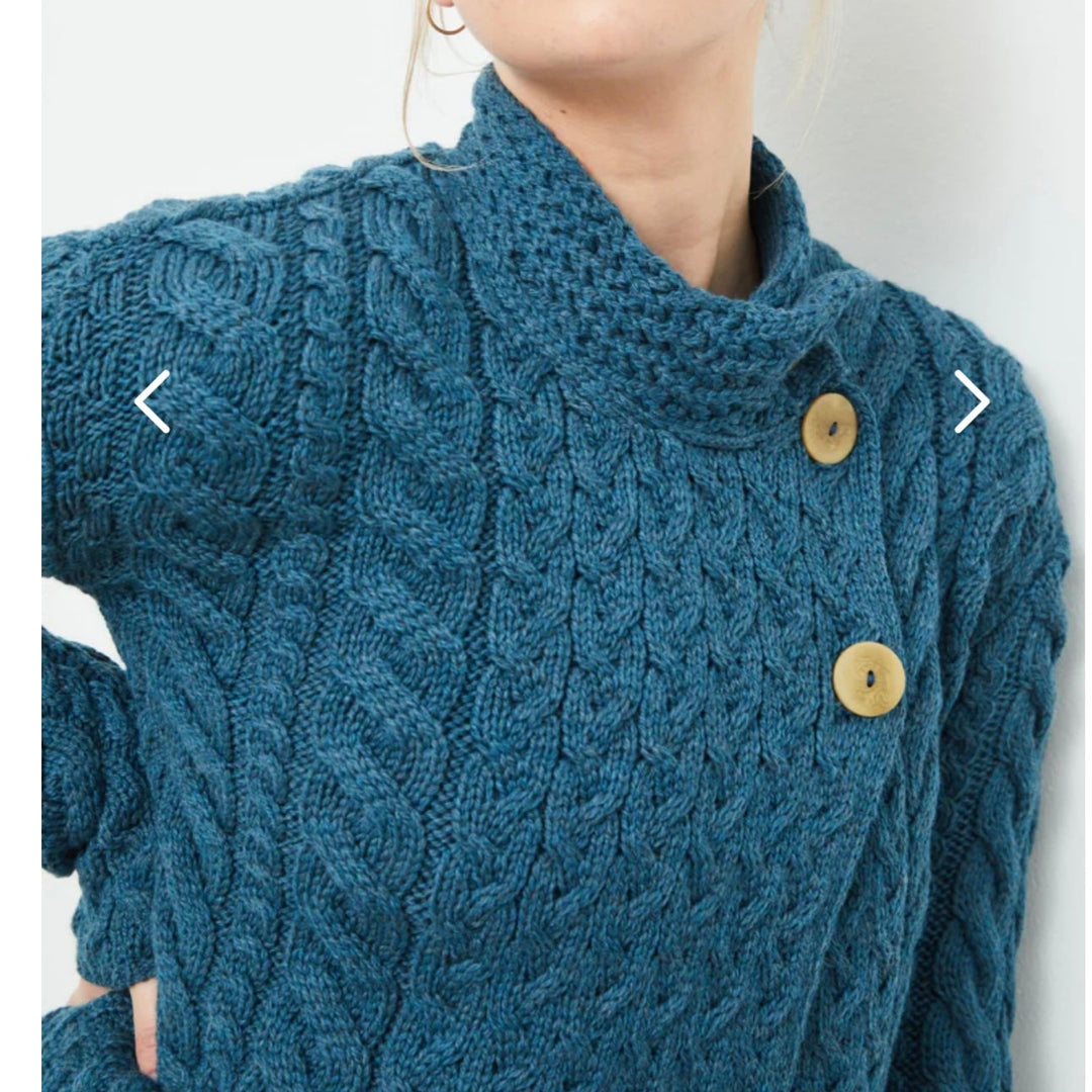 ☘️ Ladies Irish-Made Cable Knit Aran Cardigan 🧶
Comfort, Versatility, and Timeless Elegance

Wrap yourself in the warmth of tradition with our Ladies Irish-Made Cable Knit Aran Cardigan, a perfect fusion of heritage and modern style.

🌟 Key Features You’ll Love:
🧵 Premium Material: Crafted from 100% Supersoft Merino Wool, ensuring exceptional softness and warmth.
✨ Elegant Design: Features a stunning overlapping central trellis panel, combining classic Aran texture with a contemporary twist.
