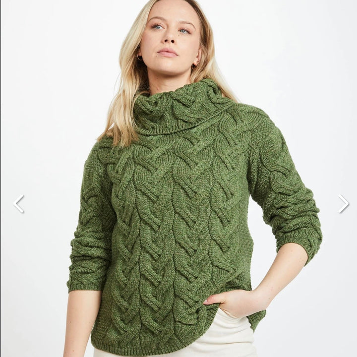 Kinsale 100% Aran Knit Sweater – Timeless Irish Style ☘️

Experience year-round warmth and elegance with the Kinsale Aran Knit Sweater, crafted from super-soft Merino wool by Aran Crafts.

✨ Features:

Iconic Cable Stitch: Bold Aran cable stitching takes center stage, complemented by subtle moss stitch side panels.
Elegant Cowl Neck: Adds a cozy and stylish touch.
Heritage Design: Inspired by the rich history of Aran knitwear, made famous globally in the 1950s.