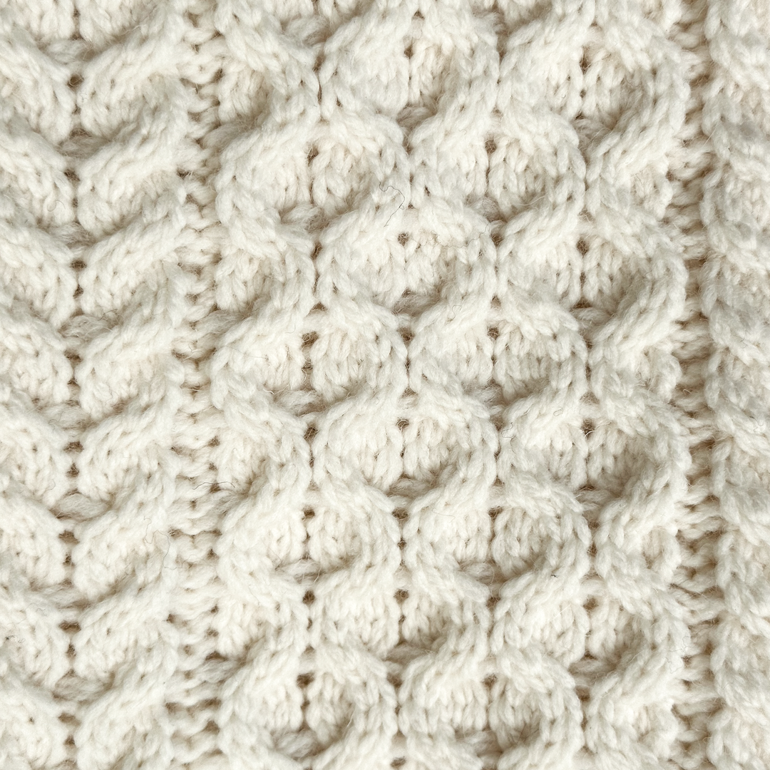 Irish Aran Knit Sweater – Timeless Craftsmanship and Comfort

Discover the perfect blend of tradition and style with our unisex Irish Aran Knit Sweater, crafted in Ireland using 100% super-soft Merino wool. 🌿

Luxurious Comfort: Soft, durable, and naturally breathable for year-round wear.
Rich Heritage: Features iconic Aran stitches like cable, honeycomb, and diamond, symbolizing strength, luck, and connection.
Crafted in Ireland: Made with care by skilled artisans, celebrating Irish knitting traditions.
