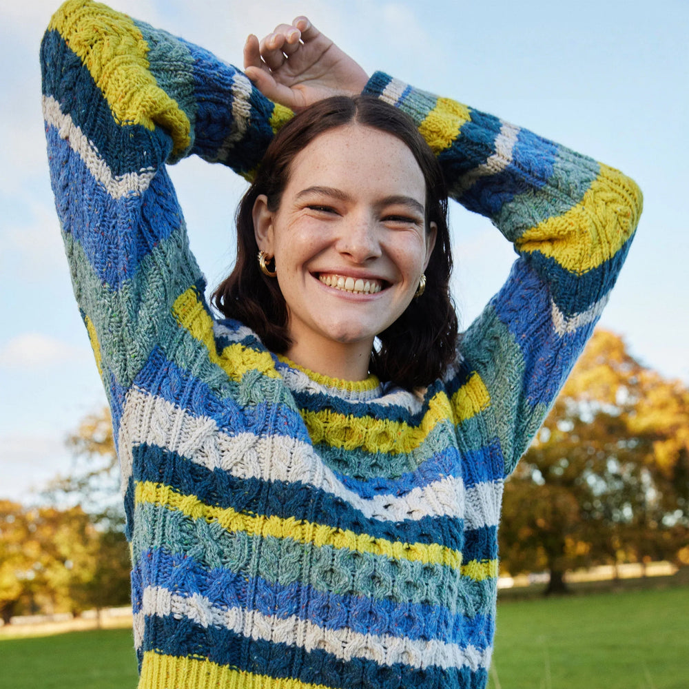 Maya Multi-Coloured Aran Sweater – Genesis Collection 🧶🌈

Part of the Genesis Collection, the ‘Maya’ sweater is a fresh take on classic Aran knitwear. It combines traditional Aran stitches with a playful, contemporary silhouette and bold multi-coloured stripes for a standout look.

✨ Designed with a vibrant marina base and contrasting stripes of chalkstone, ink marl, ocean mist &amp; buttercup, this cropped yet generous sweater is all about modern comfort with timeless style.