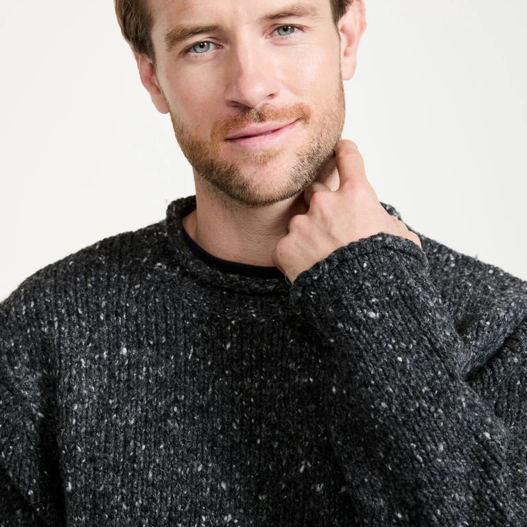 Steeped in the power of heritage and tradition.  The Raheen Tweed Roll Neck Sweater is a timeless piece that holds its place in history and the present. Featuring a rolled crew neck collar, hem and cuffs with ribbing at the neck, you’ll find this piece brings a flattering, relaxed fit.  Crafted with 100% Pure New Wool with set in sleeves and fully linked seams, the Raheen gives the wearer a perfect, smooth finish.