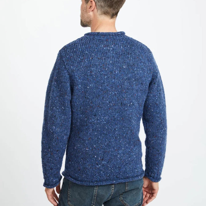 Experience the perfect mix of tradition and modern design with the Raheen Tweed Roll Neck Sweater, crafted from 100% Pure New Wool.

✨ Key Features:

Material: Luxurious 100% Pure New Wool for warmth and comfort. 🐑
Design: Rolled crew neck with ribbed hem and cuffs for a relaxed yet flattering fit. 🎨
Details: Set-in sleeves and fully linked seams ensure a smooth, seamless finish. 🧵
Versatility: Perfect for layering or wearing solo, ideal for smart-casual or cozy weekends.