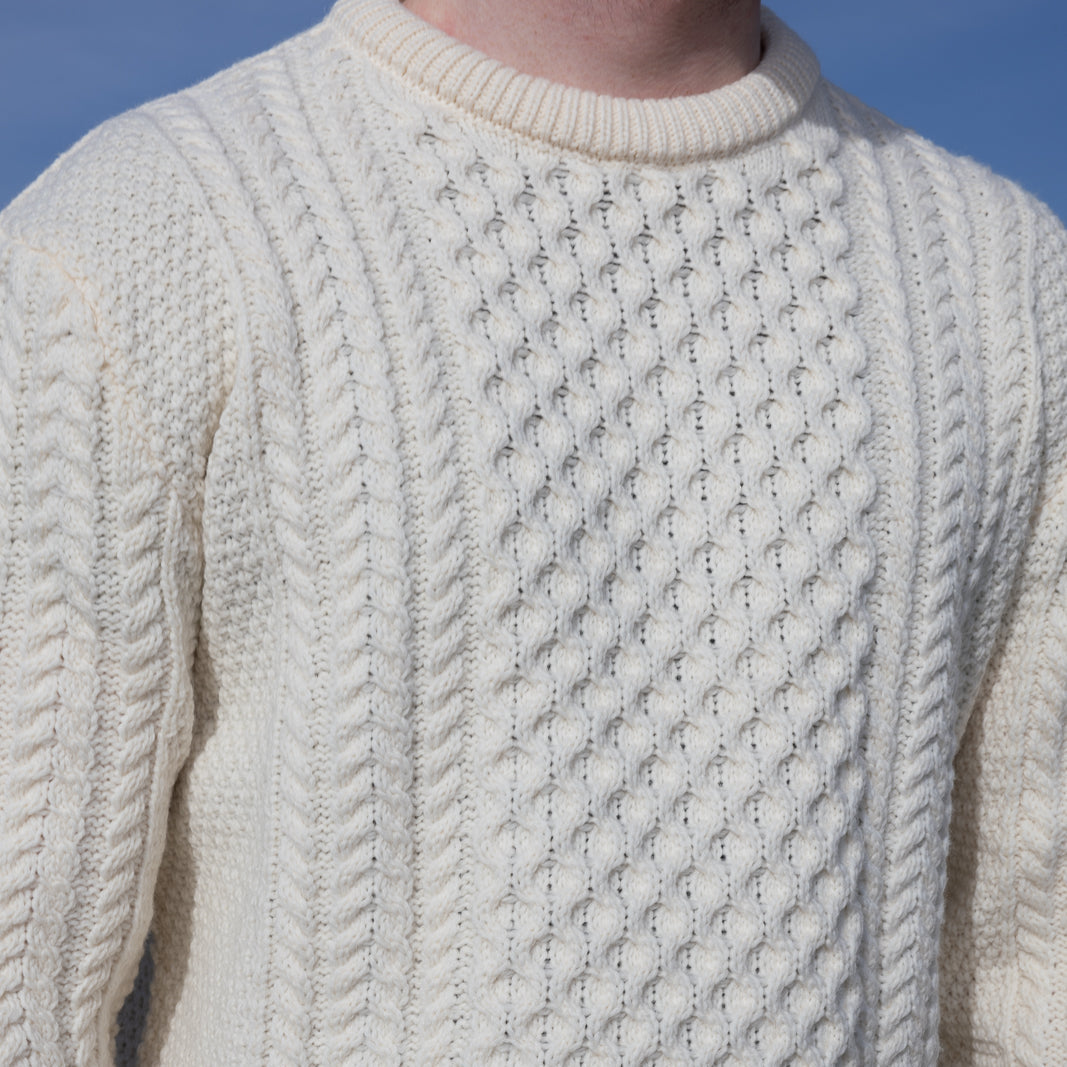 Irish Aran Knit Sweater – Timeless Craftsmanship and Comfort

Discover the perfect blend of tradition and style with our unisex Irish Aran Knit Sweater, crafted in Ireland using 100% super-soft Merino wool. 🌿

Luxurious Comfort: Soft, durable, and naturally breathable for year-round wear.
Rich Heritage: Features iconic Aran stitches like cable, honeycomb, and diamond, symbolizing strength, luck, and connection.
Crafted in Ireland: Made with care by skilled artisans, celebrating Irish knitting traditions.
