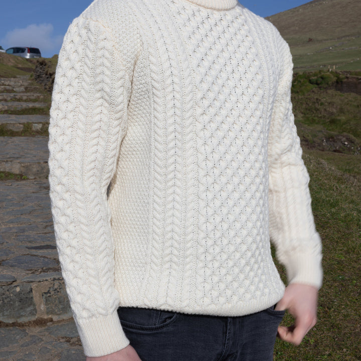 Irish Aran Knit Sweater – Timeless Craftsmanship and Comfort

Discover the perfect blend of tradition and style with our unisex Irish Aran Knit Sweater, crafted in Ireland using 100% super-soft Merino wool. 🌿

Luxurious Comfort: Soft, durable, and naturally breathable for year-round wear.
Rich Heritage: Features iconic Aran stitches like cable, honeycomb, and diamond, symbolizing strength, luck, and connection.
Crafted in Ireland: Made with care by skilled artisans, celebrating Irish knitting traditions.
