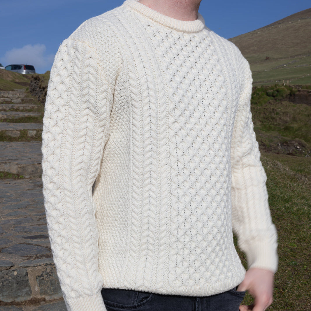 Irish Aran Knit Sweater – Timeless Craftsmanship and Comfort

Discover the perfect blend of tradition and style with our unisex Irish Aran Knit Sweater, crafted in Ireland using 100% super-soft Merino wool. 🌿

Luxurious Comfort: Soft, durable, and naturally breathable for year-round wear.
Rich Heritage: Features iconic Aran stitches like cable, honeycomb, and diamond, symbolizing strength, luck, and connection.
Crafted in Ireland: Made with care by skilled artisans, celebrating Irish knitting traditions.