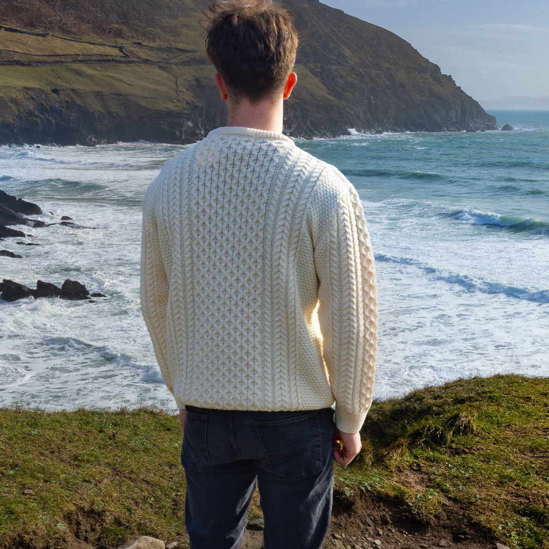 Irish Aran Knit Sweater – Timeless Craftsmanship and Comfort

Discover the perfect blend of tradition and style with our unisex Irish Aran Knit Sweater, crafted in Ireland using 100% super-soft Merino wool. 🌿

Luxurious Comfort: Soft, durable, and naturally breathable for year-round wear.
Rich Heritage: Features iconic Aran stitches like cable, honeycomb, and diamond, symbolizing strength, luck, and connection.
Crafted in Ireland: Made with care by skilled artisans, celebrating Irish knitting traditions.
V