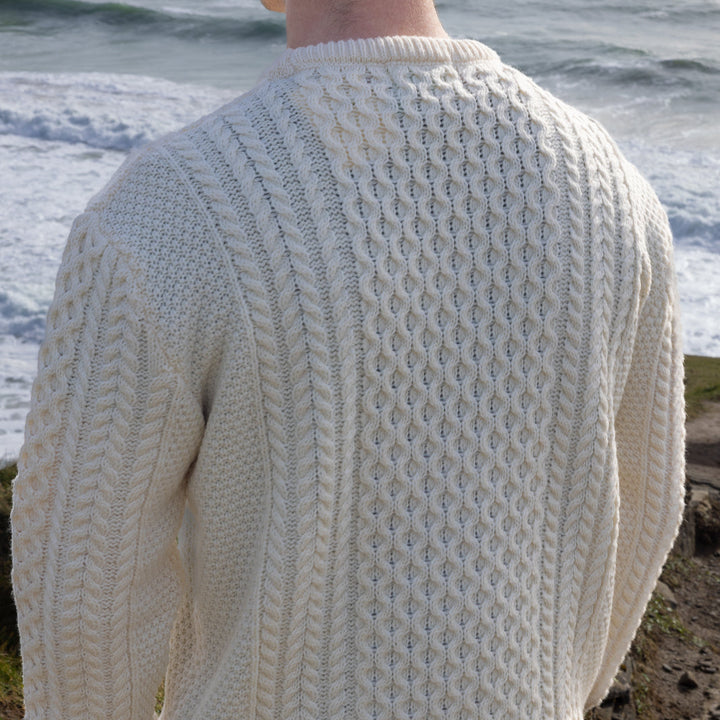 Irish Aran Knit Sweater – Timeless Craftsmanship and Comfort

Discover the perfect blend of tradition and style with our unisex Irish Aran Knit Sweater, crafted in Ireland using 100% super-soft Merino wool. 🌿

Luxurious Comfort: Soft, durable, and naturally breathable for year-round wear.
Rich Heritage: Features iconic Aran stitches like cable, honeycomb, and diamond, symbolizing strength, luck, and connection.
Crafted in Ireland: Made with care by skilled artisans, celebrating Irish knitting traditions.

