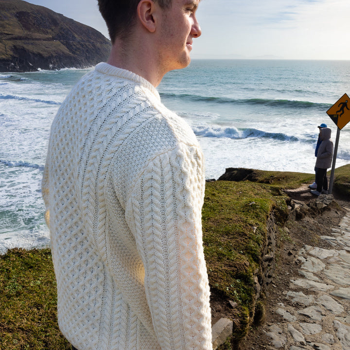 Irish Aran Knit Sweater – Timeless Craftsmanship and Comfort

Discover the perfect blend of tradition and style with our unisex Irish Aran Knit Sweater, crafted in Ireland using 100% super-soft Merino wool. 🌿

Luxurious Comfort: Soft, durable, and naturally breathable for year-round wear.
Rich Heritage: Features iconic Aran stitches like cable, honeycomb, and diamond, symbolizing strength, luck, and connection.
Crafted in Ireland: Made with care by skilled artisans, celebrating Irish knitting traditions.
