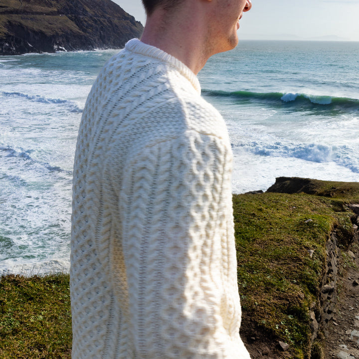 Irish Aran Knit Sweater – Timeless Craftsmanship and Comfort

Discover the perfect blend of tradition and style with our unisex Irish Aran Knit Sweater, crafted in Ireland using 100% super-soft Merino wool. 🌿

Luxurious Comfort: Soft, durable, and naturally breathable for year-round wear.
Rich Heritage: Features iconic Aran stitches like cable, honeycomb, and diamond, symbolizing strength, luck, and connection.
Crafted in Ireland: Made with care by skilled artisans, celebrating Irish knitting traditions.
