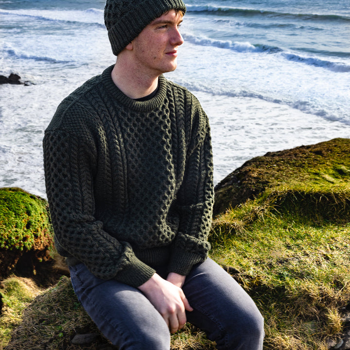 Irish Aran Knit Sweater – Timeless Craftsmanship and Comfort

Discover the perfect blend of tradition and style with our unisex Irish Aran Knit Sweater, crafted in Ireland using 100% super-soft Merino wool. 🌿

Luxurious Comfort: Soft, durable, and naturally breathable for year-round wear.
Rich Heritage: Features iconic Aran stitches like cable, honeycomb, and diamond, symbolizing strength, luck, and connection.
Crafted in Ireland: Made with care by skilled artisans, celebrating Irish knitting traditions.
