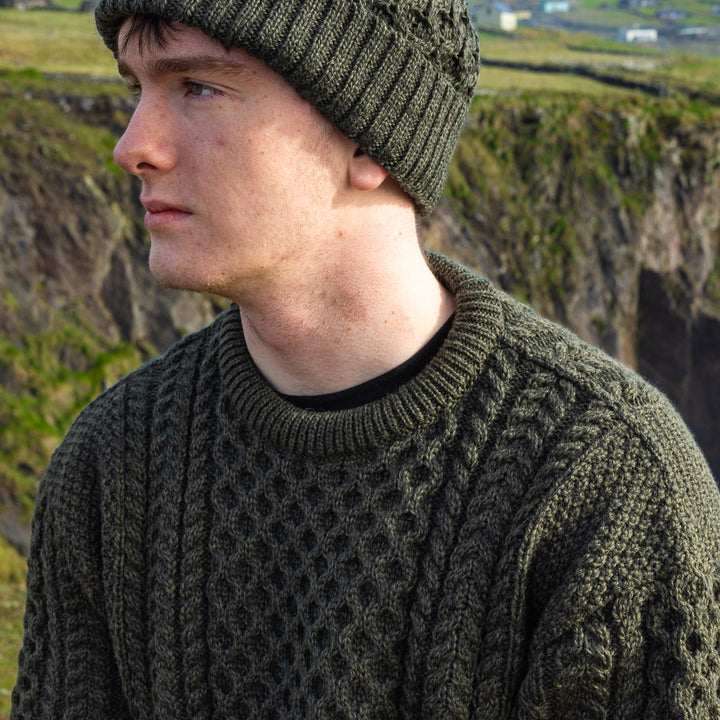 Irish Aran Knit Sweater – Timeless Craftsmanship and Comfort

Discover the perfect blend of tradition and style with our unisex Irish Aran Knit Sweater, crafted in Ireland using 100% super-soft Merino wool. 🌿

Luxurious Comfort: Soft, durable, and naturally breathable for year-round wear.
Rich Heritage: Features iconic Aran stitches like cable, honeycomb, and diamond, symbolizing strength, luck, and connection.
Crafted in Ireland: Made with care by skilled artisans, celebrating Irish knitting traditions.
