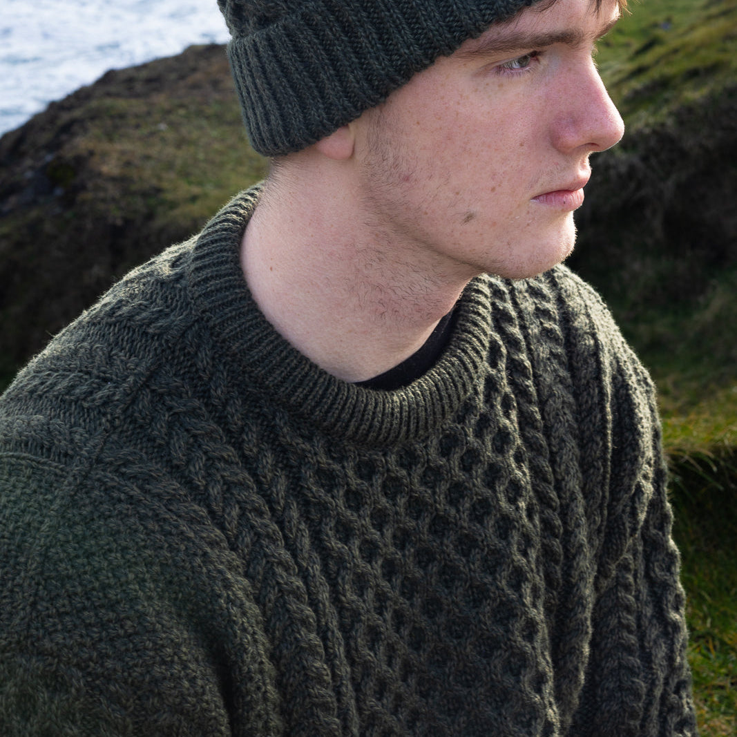 Irish Aran Knit Sweater – Timeless Craftsmanship and Comfort

Discover the perfect blend of tradition and style with our unisex Irish Aran Knit Sweater, crafted in Ireland using 100% super-soft Merino wool. 🌿

Luxurious Comfort: Soft, durable, and naturally breathable for year-round wear.
Rich Heritage: Features iconic Aran stitches like cable, honeycomb, and diamond, symbolizing strength, luck, and connection.
Crafted in Ireland: Made with care by skilled artisans, celebrating Irish knitting traditions.
V
