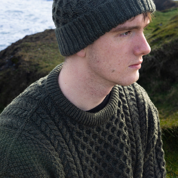 Irish Aran Knit Sweater – Timeless Craftsmanship and Comfort

Discover the perfect blend of tradition and style with our unisex Irish Aran Knit Sweater, crafted in Ireland using 100% super-soft Merino wool. 🌿

Luxurious Comfort: Soft, durable, and naturally breathable for year-round wear.
Rich Heritage: Features iconic Aran stitches like cable, honeycomb, and diamond, symbolizing strength, luck, and connection.
Crafted in Ireland: Made with care by skilled artisans, celebrating Irish knitting traditions.
