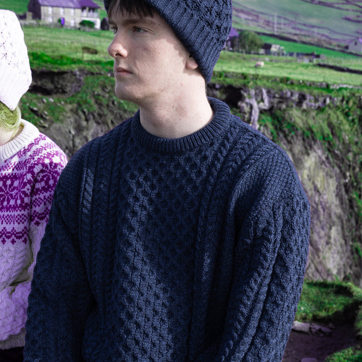 Irish Aran Knit Sweater – Timeless Craftsmanship and Comfort

Discover the perfect blend of tradition and style with our unisex Irish Aran Knit Sweater, crafted in Ireland using 100% super-soft Merino wool. 🌿

Luxurious Comfort: Soft, durable, and naturally breathable for year-round wear.
Rich Heritage: Features iconic Aran stitches like cable, honeycomb, and diamond, symbolizing strength, luck, and connection.
Crafted in Ireland: Made with care by skilled artisans, celebrating Irish knitting traditions.
