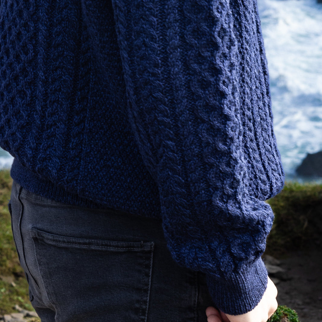 Irish Aran Knit Sweater – Timeless Craftsmanship and Comfort

Discover the perfect blend of tradition and style with our unisex Irish Aran Knit Sweater, crafted in Ireland using 100% super-soft Merino wool. 🌿

Luxurious Comfort: Soft, durable, and naturally breathable for year-round wear.
Rich Heritage: Features iconic Aran stitches like cable, honeycomb, and diamond, symbolizing strength, luck, and connection.
Crafted in Ireland: Made with care by skilled artisans, celebrating Irish knitting traditions.
