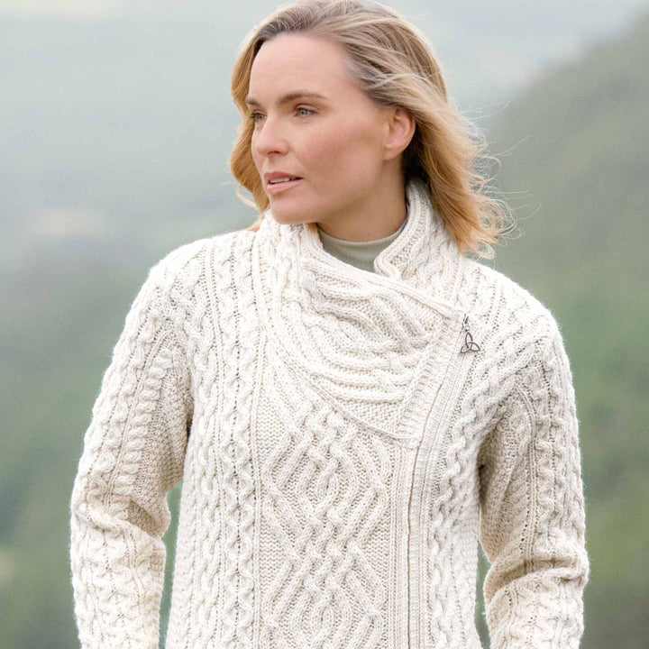 ☘️ Ladies Irish-Made Side-Zip Cable Knit Aran Cardigan 🧶
Biker Style Meets Timeless Irish Craftsmanship

Elevate your wardrobe with the Ladies Irish-Made Side-Zip Cable Knit Aran Cardigan, a bold take on traditional Aran knitwear with a modern, biker-inspired twist.

🌟 Key Features You’ll Love:
🧵 Premium Material: Made from 100% Supersoft Merino Wool for unmatched warmth, softness, and comfort.
🪡 Stylish Design: Features a unique side-zip closure, adding a modern biker edge to the classic Aran cardigan.
