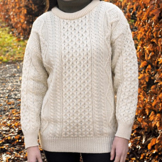 Irish Aran Knit Sweater – Timeless Craftsmanship and Comfort

Discover the perfect blend of tradition and style with our unisex Irish Aran Knit Sweater, crafted in Ireland using 100% super-soft Merino wool. 🌿

Luxurious Comfort: Soft, durable, and naturally breathable for year-round wear.
Rich Heritage: Features iconic Aran stitches like cable, honeycomb, and diamond, symbolizing strength, luck, and connection.
Crafted in Ireland: Made with care by skilled artisans, celebrating Irish knitting traditions.
