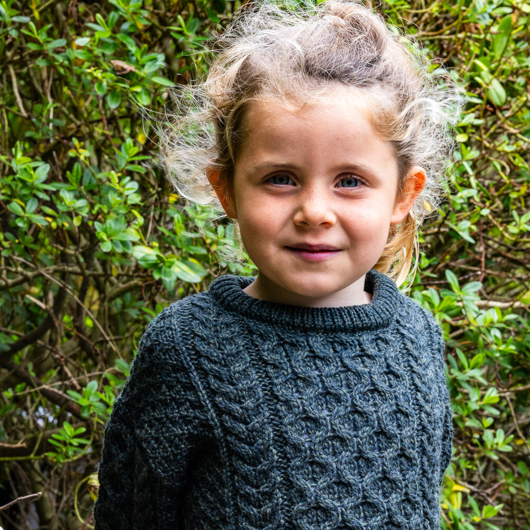 Children's Authentic Aran Knitwear – Irish Craftsmanship &amp; Timeless Style

Wrap your little ones in the enchanting warmth of authentic Aran knit Sweaters, crafted in Ireland with 100% soft merino wool for unbeatable comfort and durability.

🌟 Heritage Design: Featuring intricate Aran stitches like cable, honeycomb, and trinity, each piece tells a unique story.
🍂 Versatile Styles: From cozy crew necks to classic button-downs, perfect for layering or keeping warm.
🎨 Sizes &amp; Colors: A variety of opt