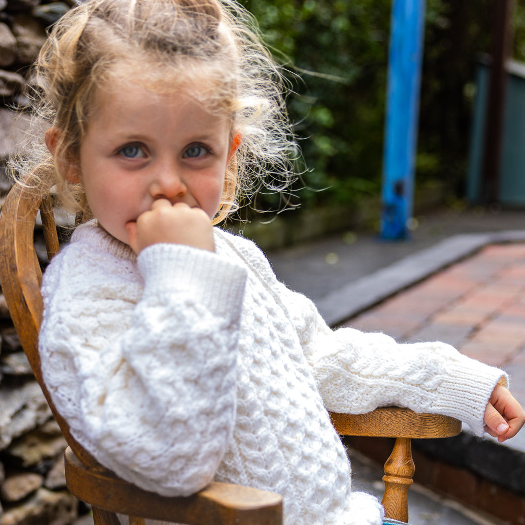 Children's Authentic Aran Knitwear – Irish Craftsmanship &amp; Timeless Style

Wrap your little ones in the enchanting warmth of authentic Aran knit Sweaters, crafted in Ireland with 100% soft merino wool for unbeatable comfort and durability.

🌟 Heritage Design: Featuring intricate Aran stitches like cable, honeycomb, and trinity, each piece tells a unique story.
🍂 Versatile Styles: From cozy crew necks to classic button-downs, perfect for layering or keeping warm.