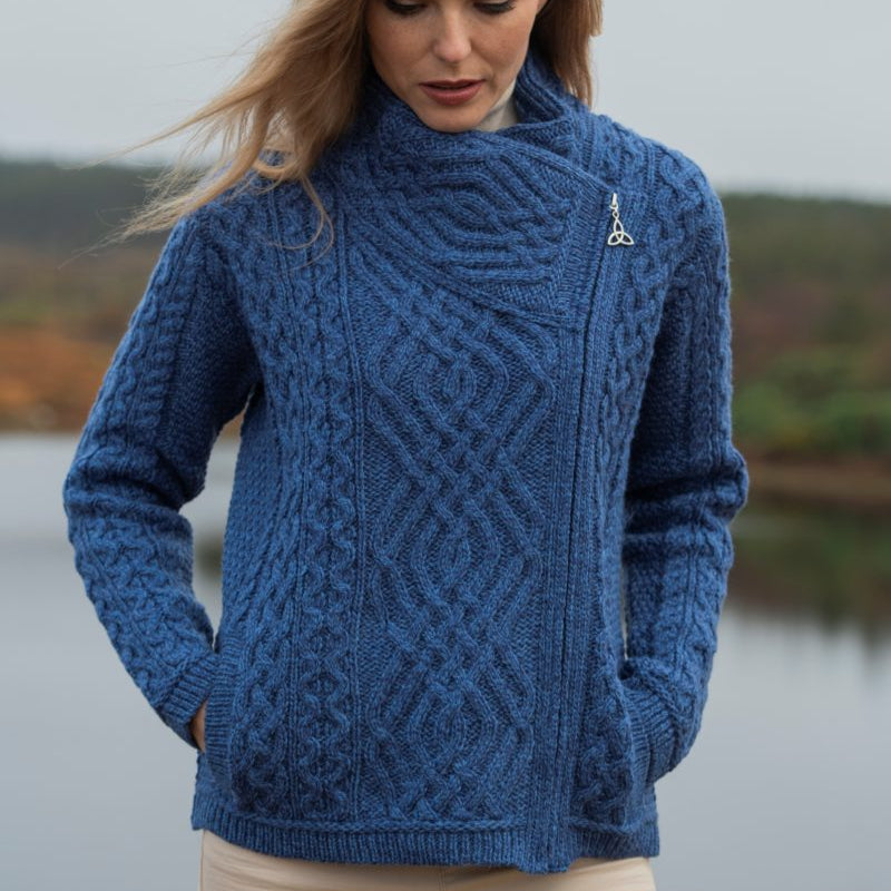 ☘️ Ladies Irish-Made Side-Zip Cable Knit Aran Cardigan 🧶
Biker Style Meets Timeless Irish Craftsmanship

Elevate your wardrobe with the Ladies Irish-Made Side-Zip Cable Knit Aran Cardigan, a bold take on traditional Aran knitwear with a modern, biker-inspired twist.

🌟 Key Features You’ll Love:
🧵 Premium Material: Made from 100% Supersoft Merino Wool for unmatched warmth, softness, and comfort.
🪡 Stylish Design: Features a unique side-zip closure, adding a modern biker edge to the classic Aran car