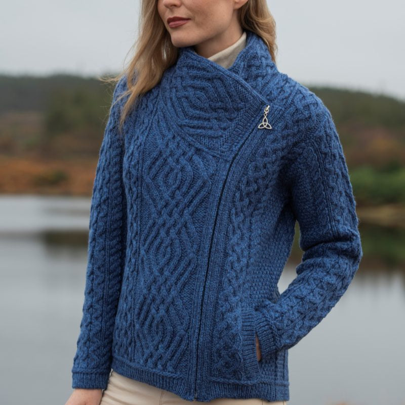 ☘️ Ladies Irish-Made Side-Zip Cable Knit Aran Cardigan 🧶
Biker Style Meets Timeless Irish Craftsmanship

Elevate your wardrobe with the Ladies Irish-Made Side-Zip Cable Knit Aran Cardigan, a bold take on traditional Aran knitwear with a modern, biker-inspired twist.

🌟 Key Features You’ll Love:
🧵 Premium Material: Made from 100% Supersoft Merino Wool for unmatched warmth, softness, and comfort.
🪡 Stylish Design: Features a unique side-zip closure, adding a modern biker edge to the classic Aran ca
