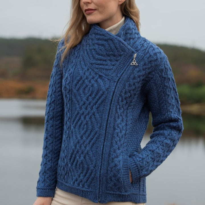 ☘️ Ladies Irish-Made Side-Zip Cable Knit Aran Cardigan 🧶
Biker Style Meets Timeless Irish Craftsmanship

Elevate your wardrobe with the Ladies Irish-Made Side-Zip Cable Knit Aran Cardigan, a bold take on traditional Aran knitwear with a modern, biker-inspired twist.

🌟 Key Features You’ll Love:
🧵 Premium Material: Made from 100% Supersoft Merino Wool for unmatched warmth, softness, and comfort.
🪡 Stylish Design: Features a unique side-zip closure, adding a modern biker edge to the classic Aran ca
