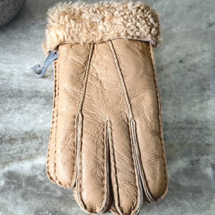 Indulge in unmatched comfort and sophistication with our exquisite sheepskin gloves, meticulously crafted to elevate your winter wardrobe. Made from premium sheepskin leather, these gloves offer unparalleled softness and warmth, ensuring your hands stay cozy even in the coldest of temperatures.