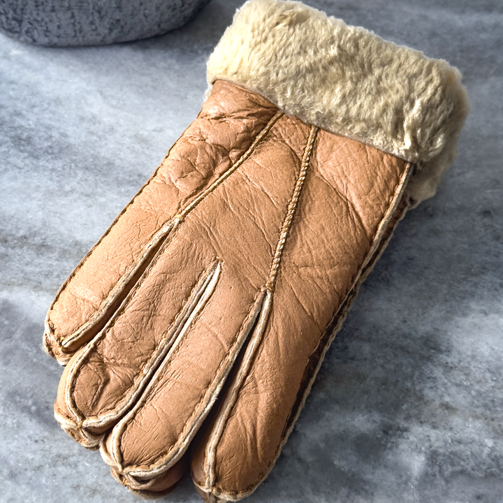 Indulge in unmatched comfort and sophistication with our exquisite sheepskin gloves, meticulously crafted to elevate your winter wardrobe. Made from premium sheepskin leather, these gloves offer unparalleled softness and warmth, ensuring your hands stay cozy even in the coldest of temperatures.