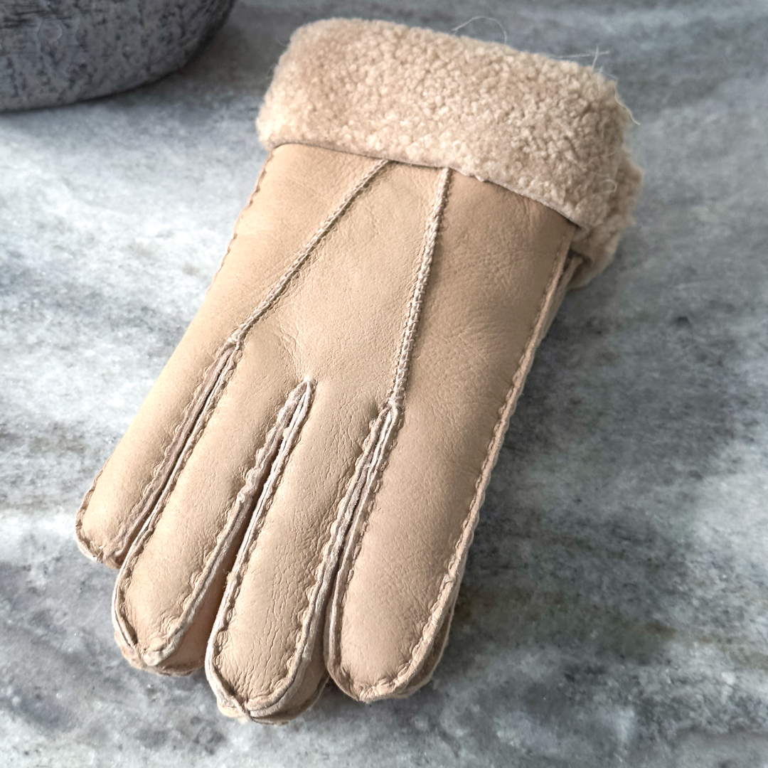 Indulge in unmatched comfort and sophistication with our exquisite sheepskin gloves, meticulously crafted to elevate your winter wardrobe. Made from premium sheepskin leather, these gloves offer unparalleled softness and warmth, ensuring your hands stay cozy even in the coldest of temperatures.