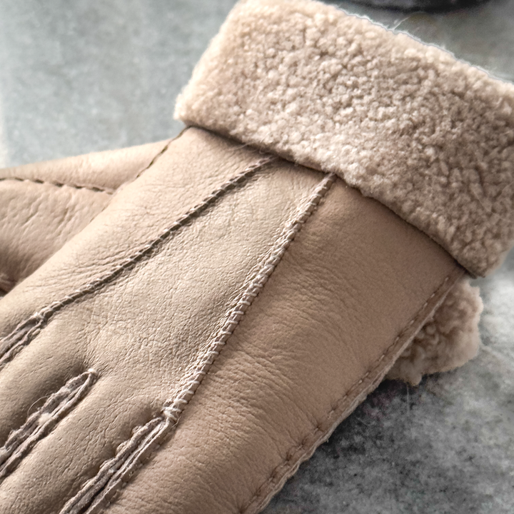 Indulge in unmatched comfort and sophistication with our exquisite sheepskin gloves, meticulously crafted to elevate your winter wardrobe. Made from premium sheepskin leather, these gloves offer unparalleled softness and warmth, ensuring your hands stay cozy even in the coldest of temperatures.