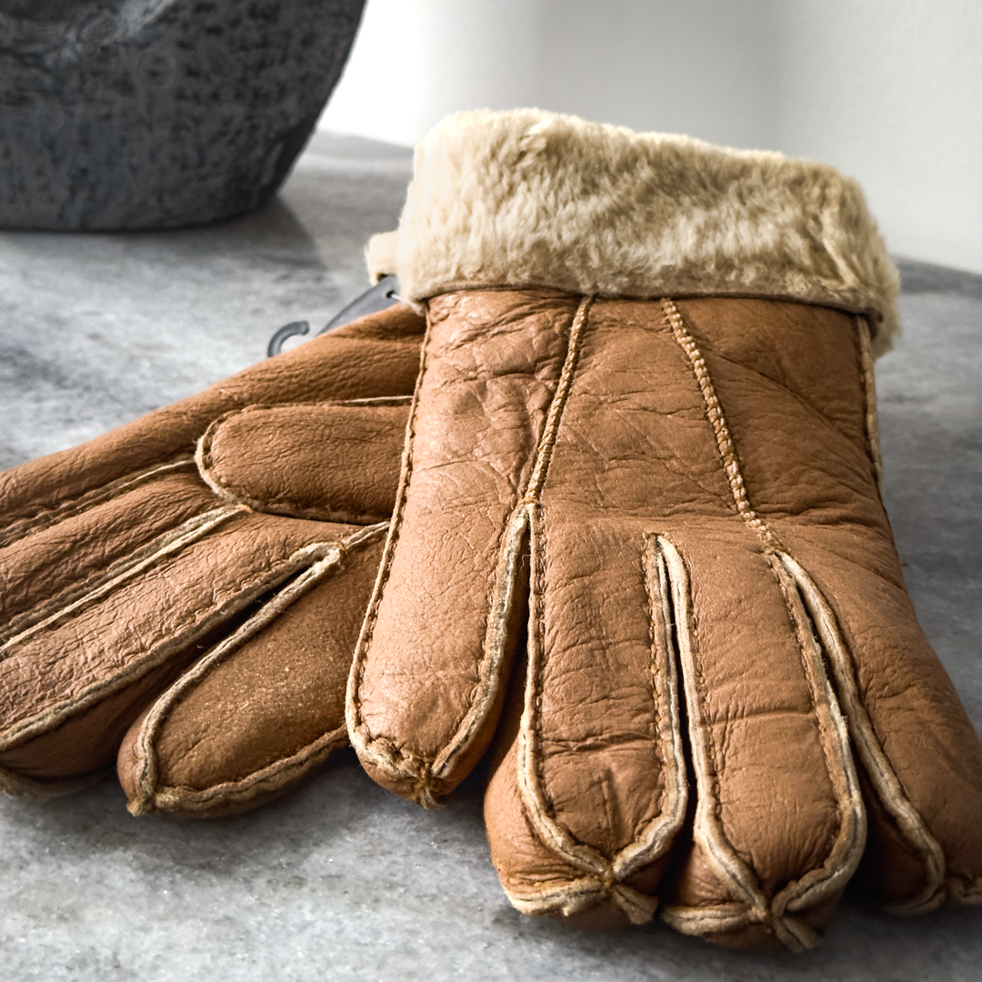 Indulge in unmatched comfort and sophistication with our exquisite sheepskin gloves, meticulously crafted to elevate your winter wardrobe. Made from premium sheepskin leather, these gloves offer unparalleled softness and warmth, ensuring your hands stay cozy even in the coldest of temperatures.