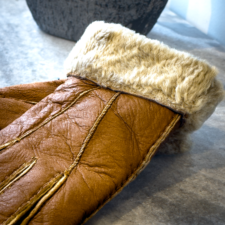 Indulge in unmatched comfort and sophistication with our exquisite sheepskin gloves, meticulously crafted to elevate your winter wardrobe. Made from premium sheepskin leather, these gloves offer unparalleled softness and warmth, ensuring your hands stay cozy even in the coldest of temperatures.