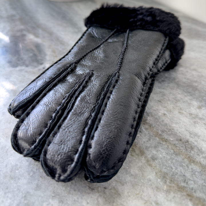 Indulge in unmatched comfort and sophistication with our exquisite sheepskin gloves, meticulously crafted to elevate your winter wardrobe. Made from premium sheepskin leather, these gloves offer unparalleled softness and warmth, ensuring your hands stay cozy even in the coldest of temperatures.